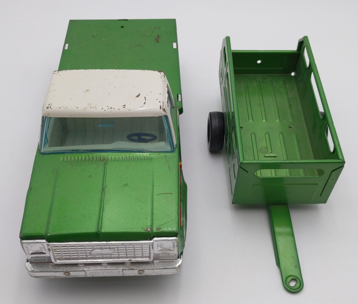 Vintage Nylint Farms green truck and deals trailer.